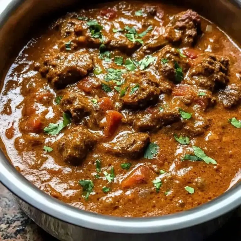 Rich and Tender Slow-Cooked Beef Curry in Coconut Milk, Served Over Fragrant Rice